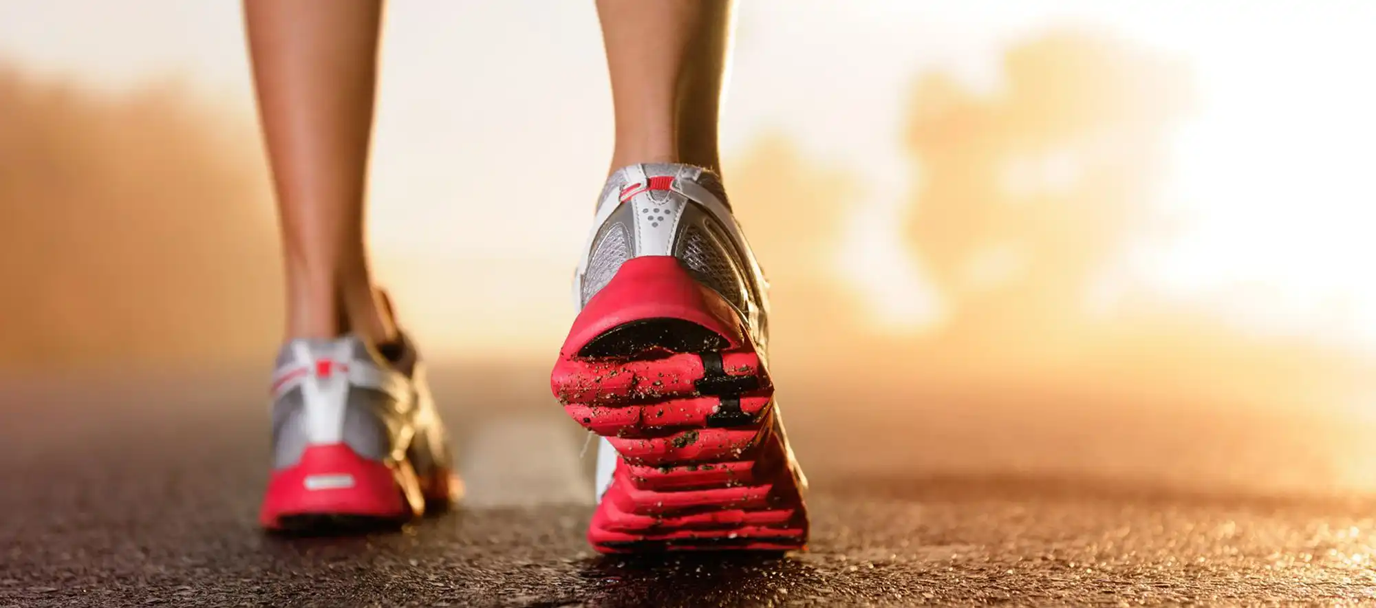 Shin pain when running — runner’s shoes on road, MTSS context, Brisbane.